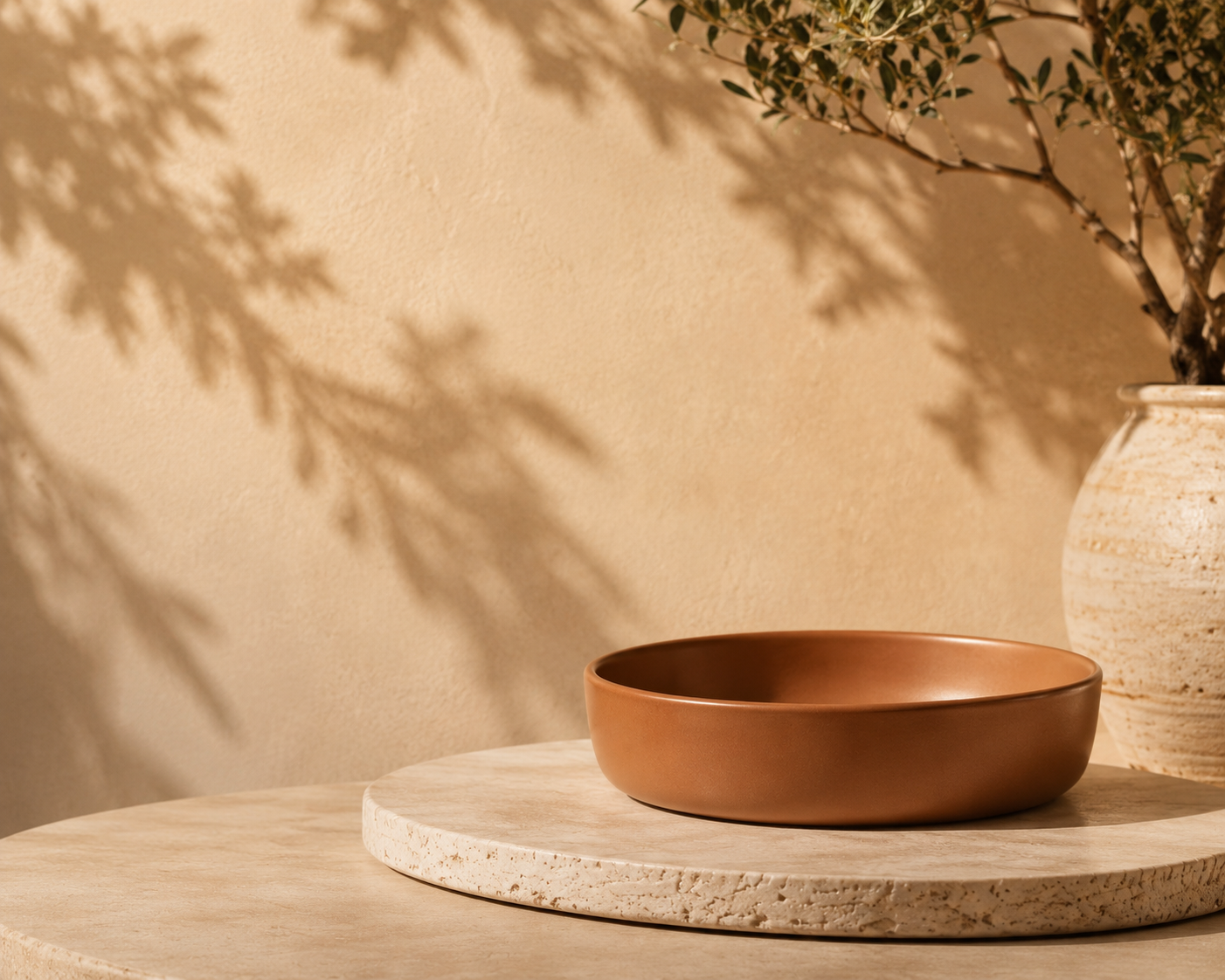 Handmade ceramic bowl on a wooden side table
